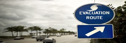 Picture of an evacuation sign with cars