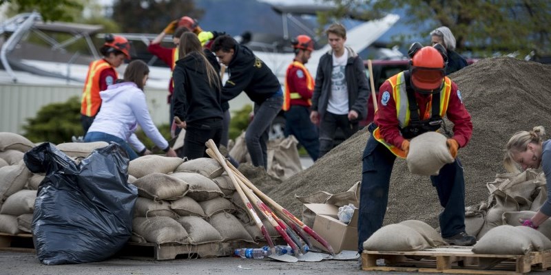 People Filling Sandbags